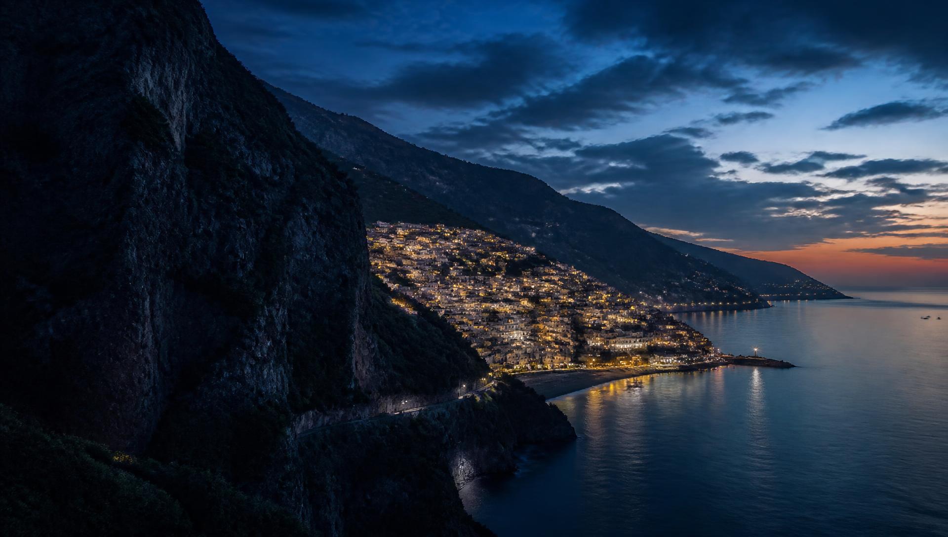 Illuminated Amalfi Coast village at dusk